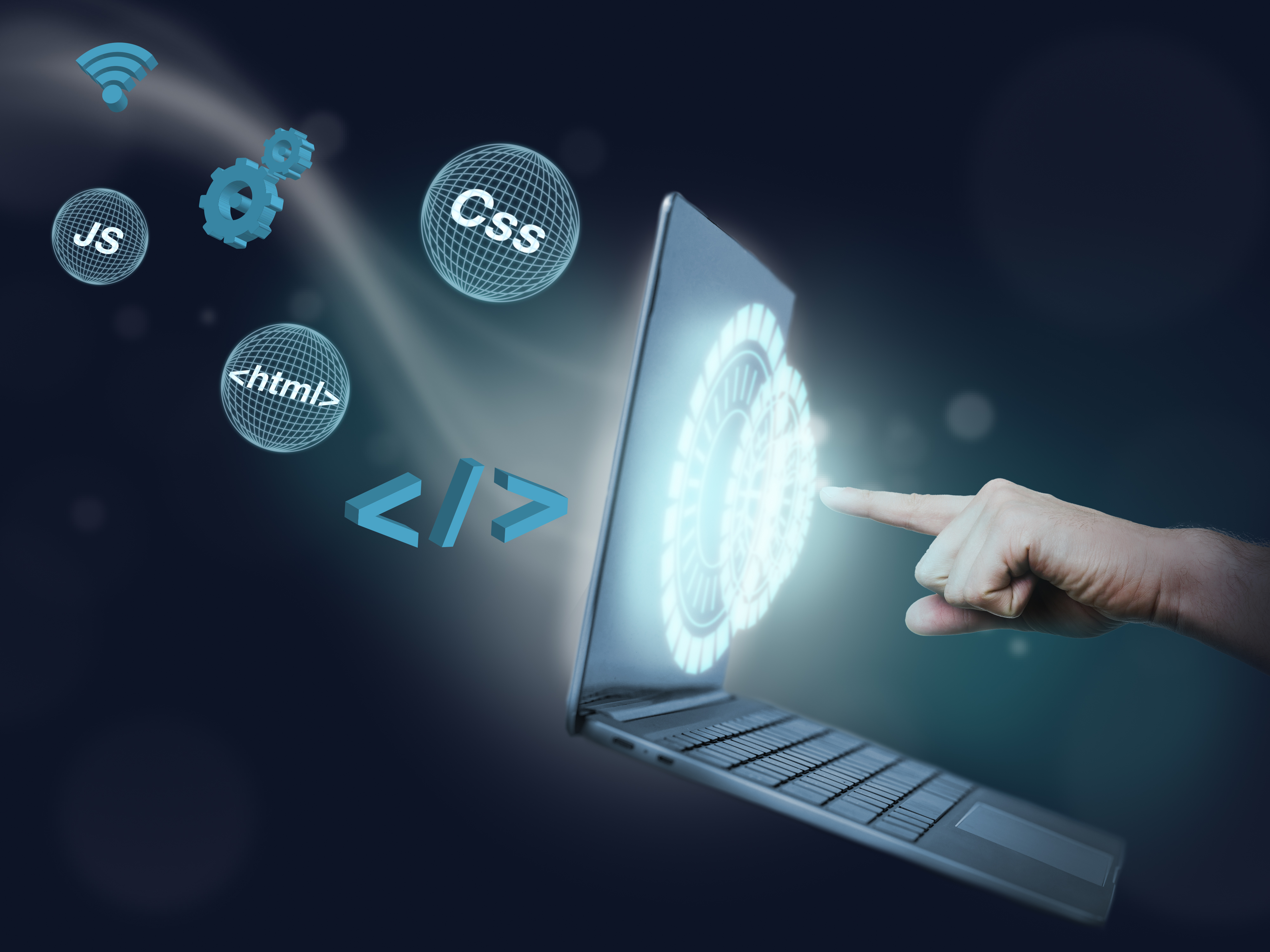 JavaScript, HTML en CSS symbolen naast een laptop
